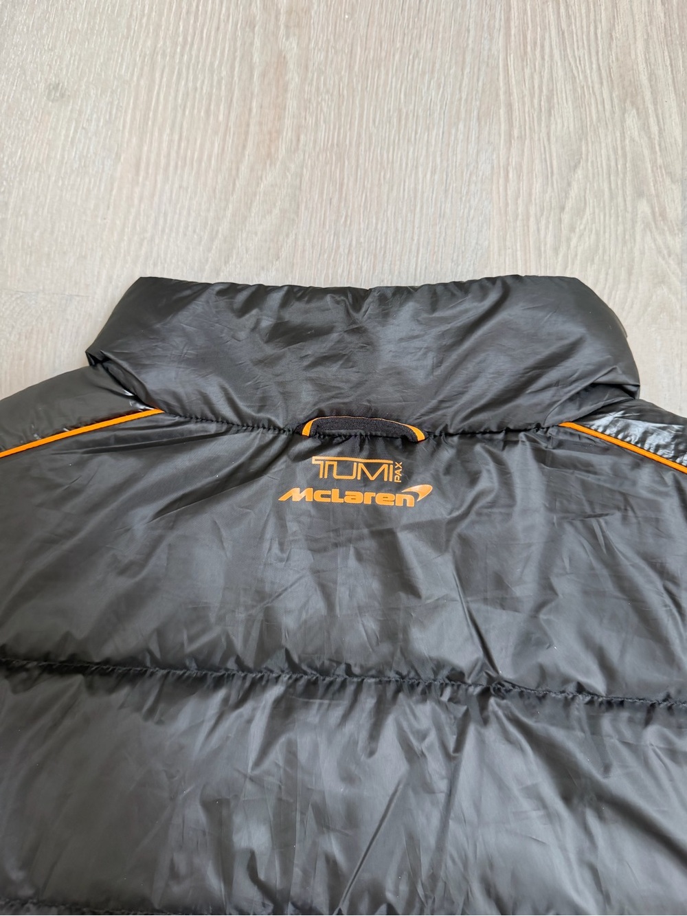 TumiPAX McLaren Packable Black Puffer Vest/Pillow with Orange Trim - Picture 5 of 12